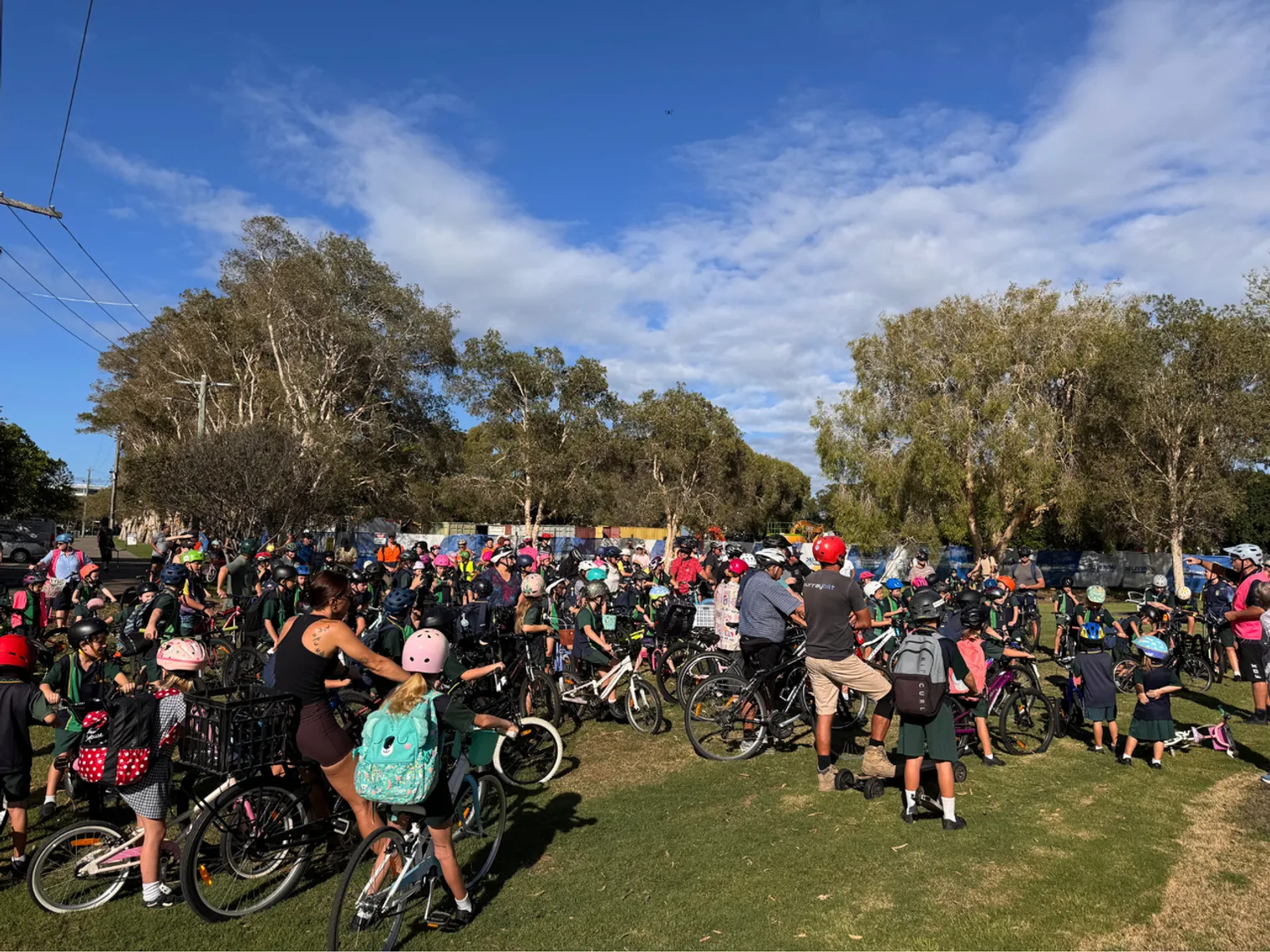 Hundreds of kids on bikes and scooters getting ready to ride to Golden Beach State School
