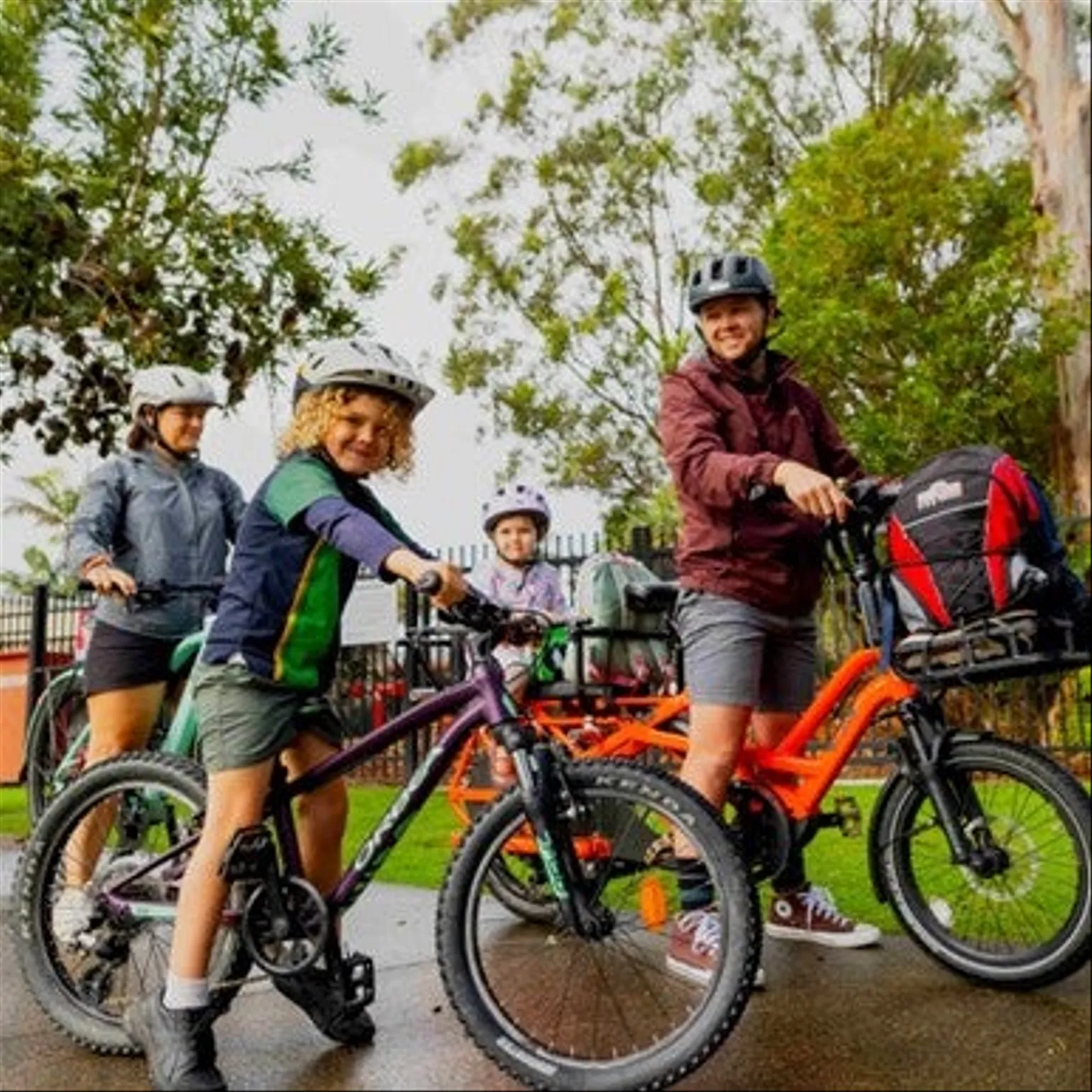 Parents riding to school with children.